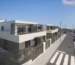 Modern apartment buildings along a newly built street