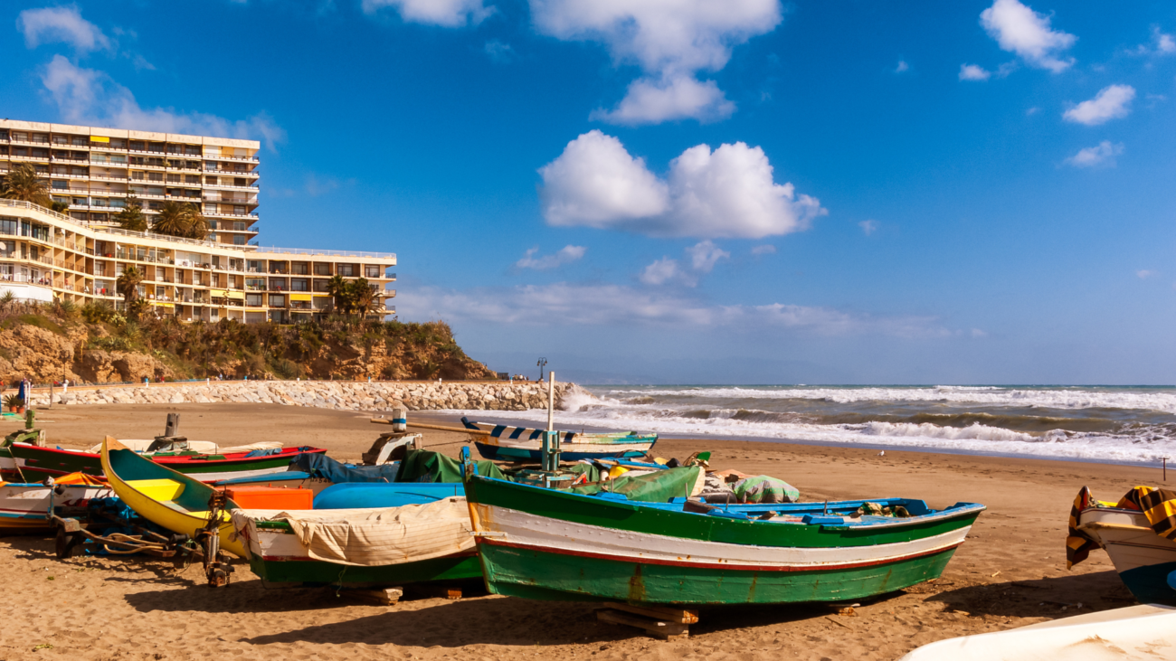 Traditional wooden fishing boats on a Costa del Sol beach
