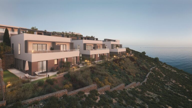 Hillside homes at sunset facing the sea