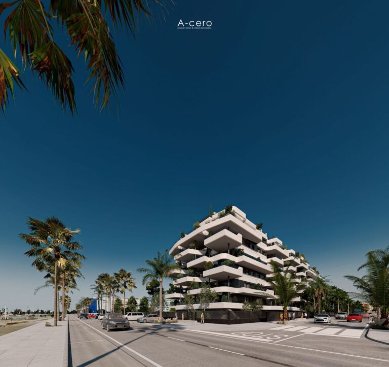 Frontline beach apartment building with palm trees on the promenade