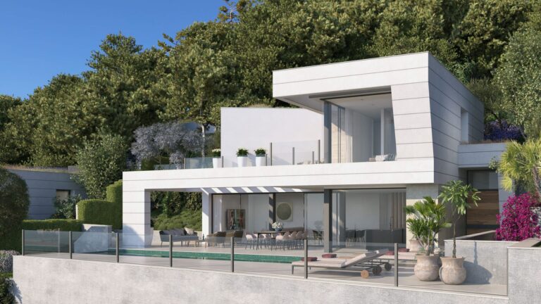 Modern white villa among pine trees