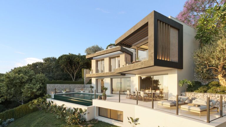 Villa with dark cladding and pool at sunset