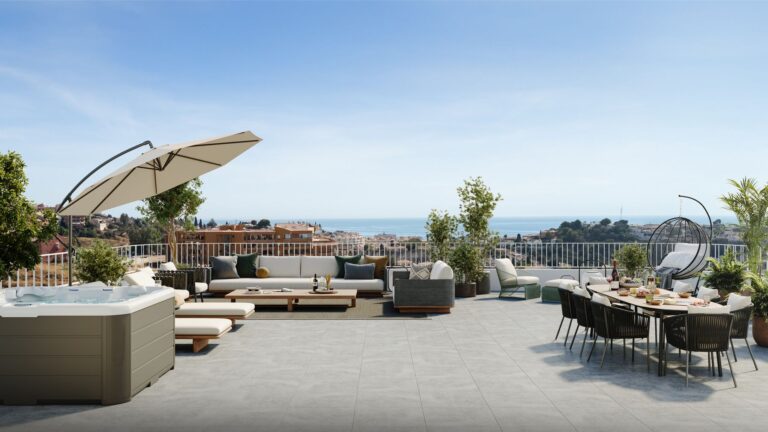 Roof terrace with outdoor dining area and views towards the sea